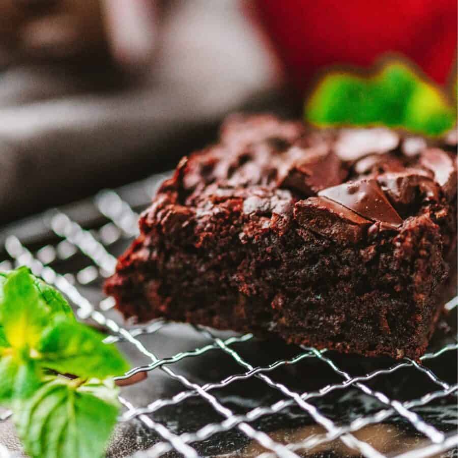 A Zucchini Brownie on a wire cooling rack