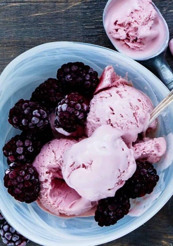Overhead image of Blackberry Ice Cream in a blue bowl with extra berries