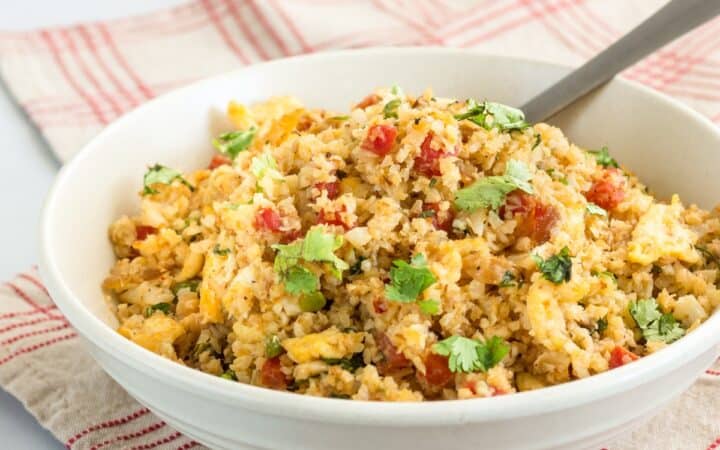 Cauliflower Fried Rice in a bowl with a fork