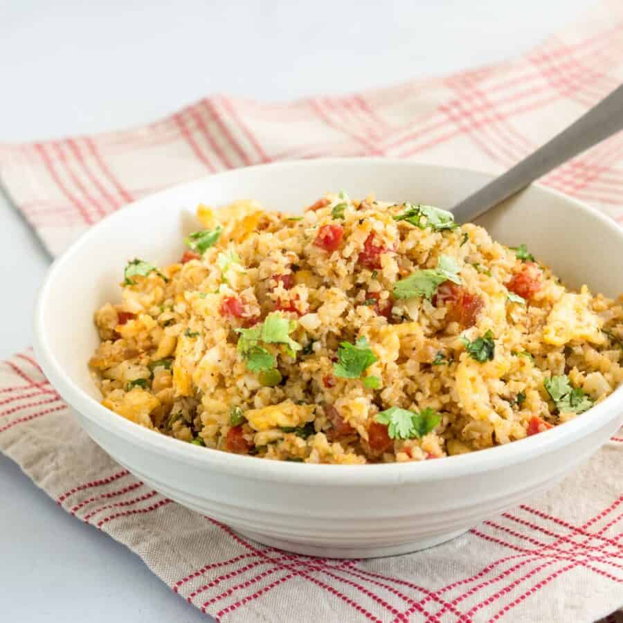 Cauliflower Fried Rice in a bowl with a fork