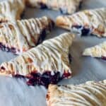 Close up image of Cherry Turnovers on parchment paper - 8