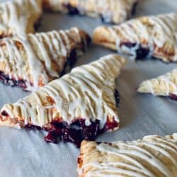 Close up image of Cherry Turnovers on parchment paper