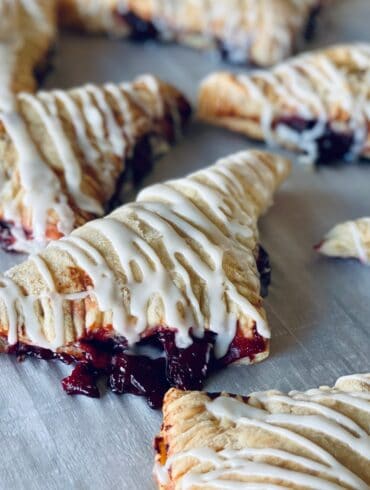 Close up image of Cherry Turnovers on parchment paper