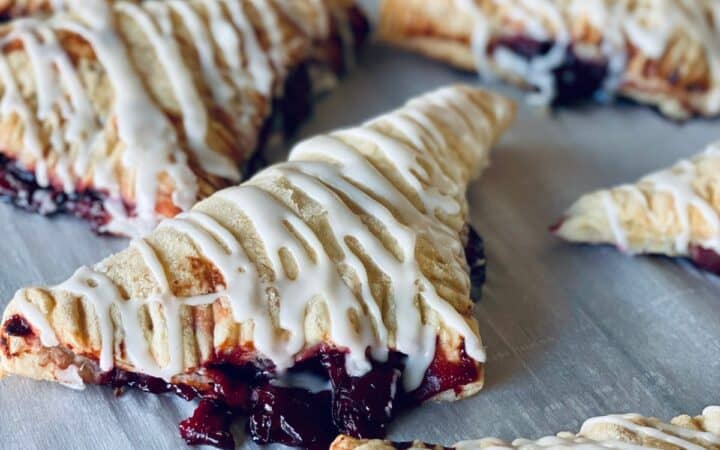 Close up image of Cherry Turnovers on parchment paper