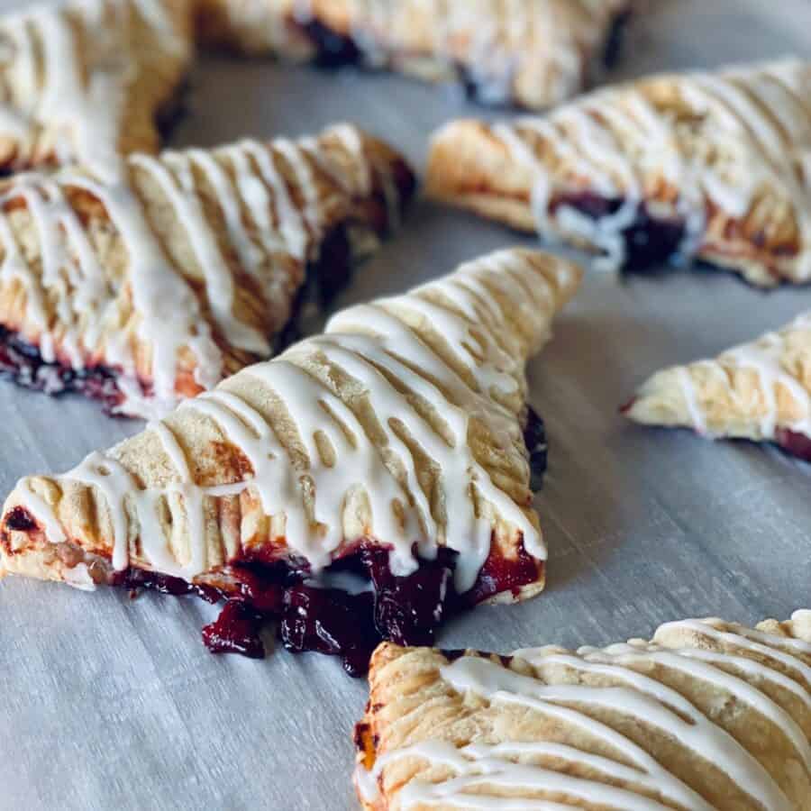 Close up image of Cherry Turnovers on parchment paper