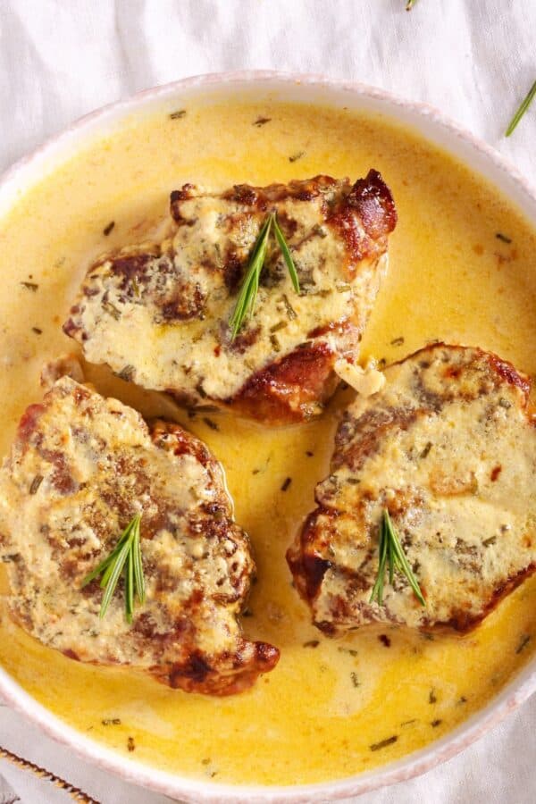 Overhead image of Creamy Pork Chops in a white bowl