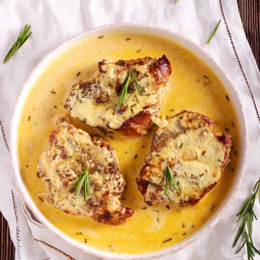 Overhead image of Creamy Pork Chops in a white bowl