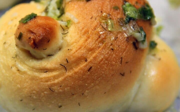 Close up image of Garlic Knots on parchment paper