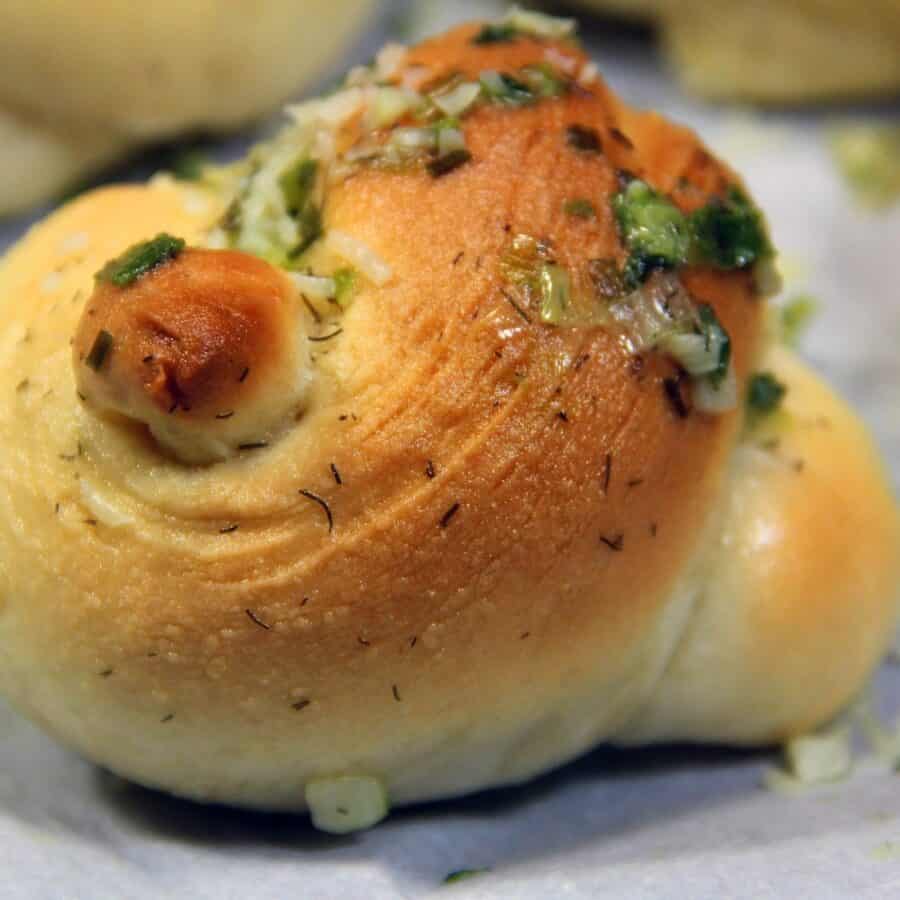 Close up image of Garlic Knots on parchment paper