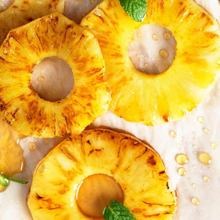 Close up image of slices of grilled pineapple