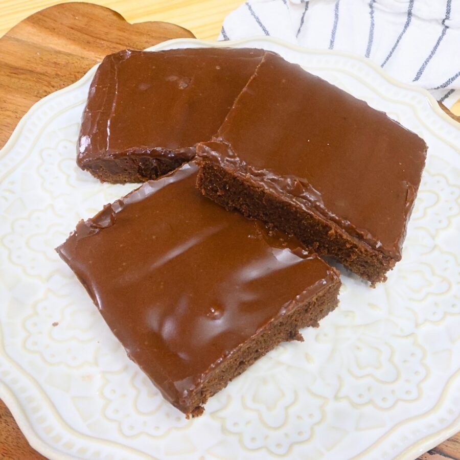 Three lunch lady brownies on a decorative plate