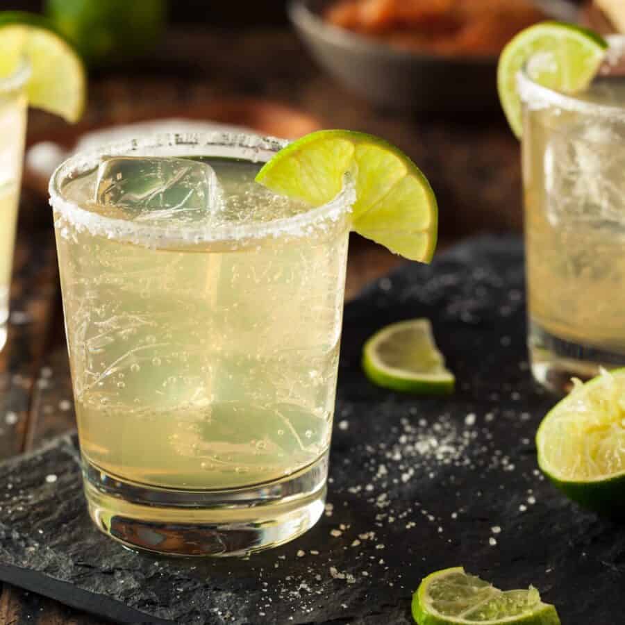 non alcoholic margaritas on a cutting board with salt and lime