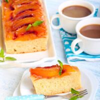 Overhead image of Peach Upside Down Cake with a slice on a plate
