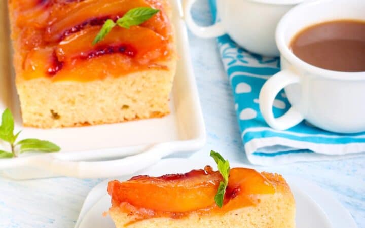 Overhead image of Peach Upside Down Cake with a slice on a plate