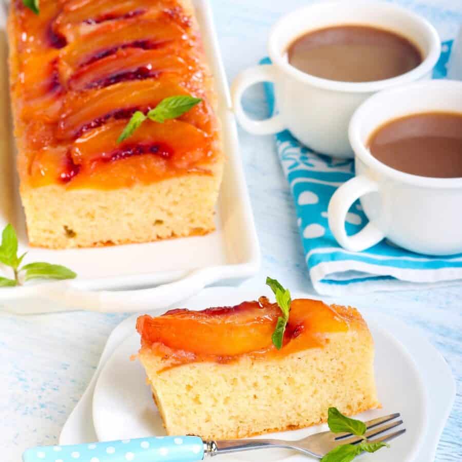 Overhead image of Peach Upside Down Cake with a slice on a plate