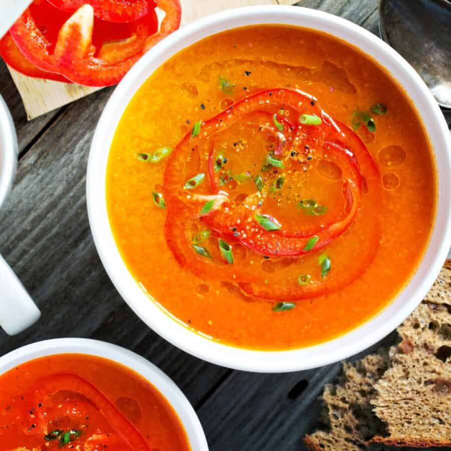 Overhead image of two bowls of Roasted Red Pepper Soup