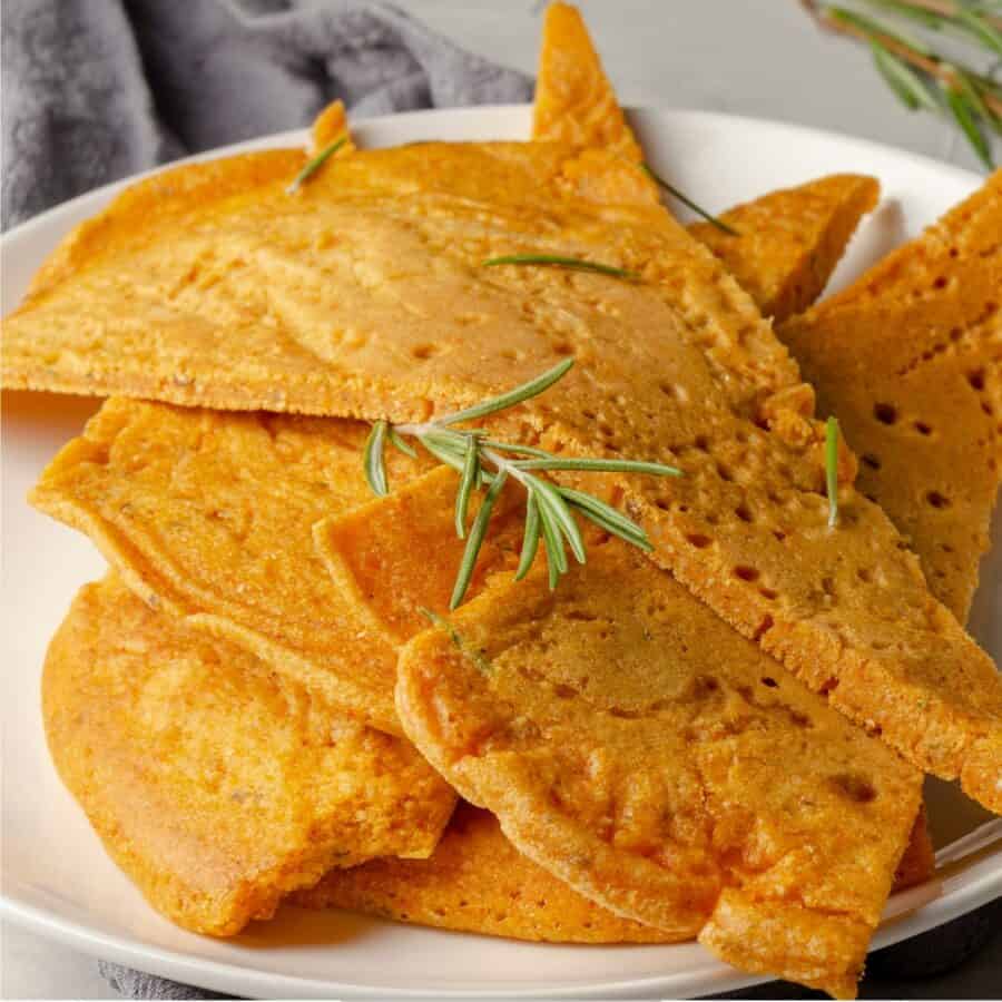 Close up image of socca with herbs