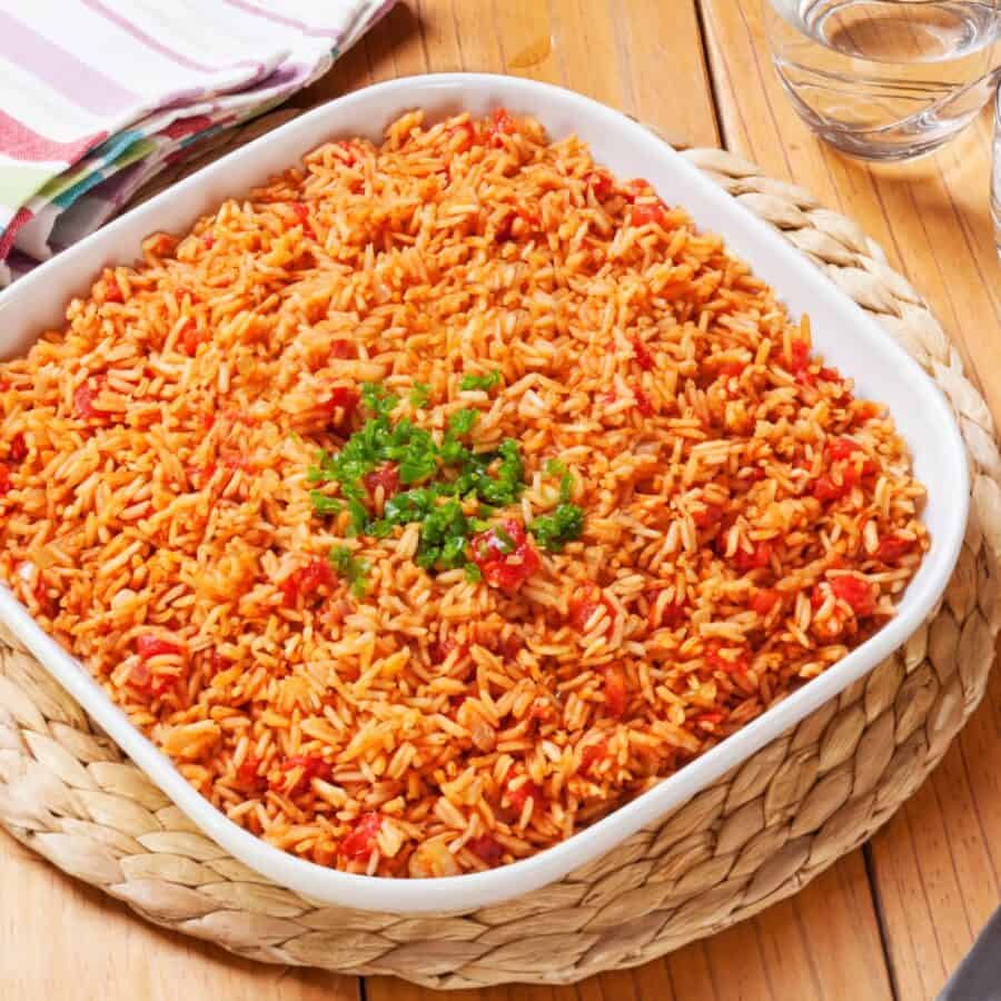 Overhead image of Spanish Rice in a square white container