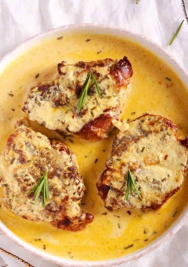 Overhead image of Creamy Pork Chops in a white bowl
