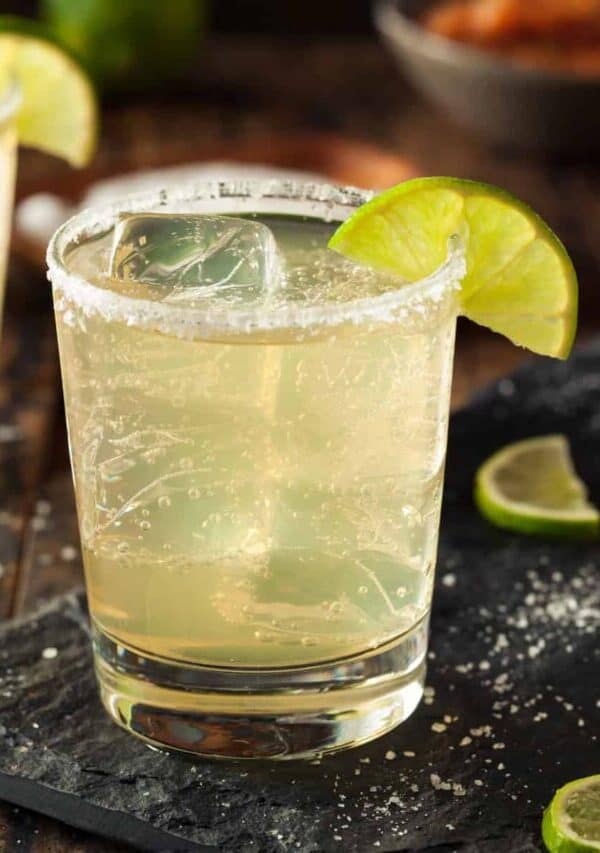 non alcoholic margaritas on a cutting board with salt and lime