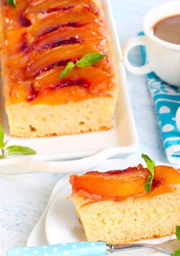 Overhead image of Peach Upside Down Cake with a slice on a plate