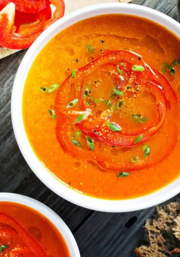 Overhead image of two bowls of Roasted Red Pepper Soup