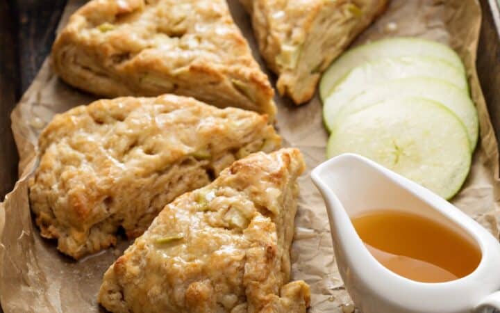 Apple Scones on parchment apper with caramel sauce