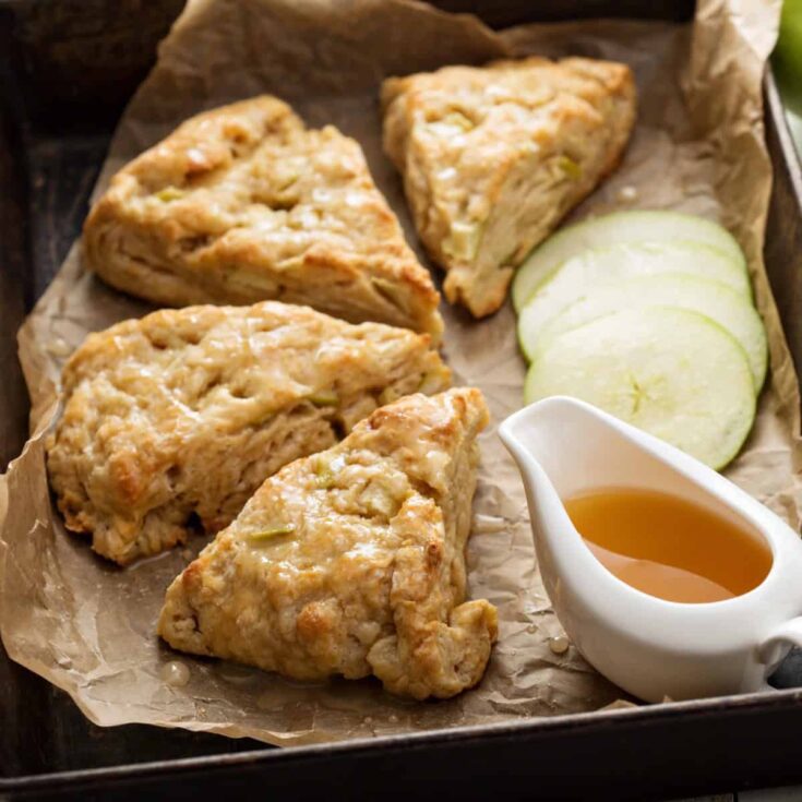 Apple Scones on parchment apper with caramel sauce