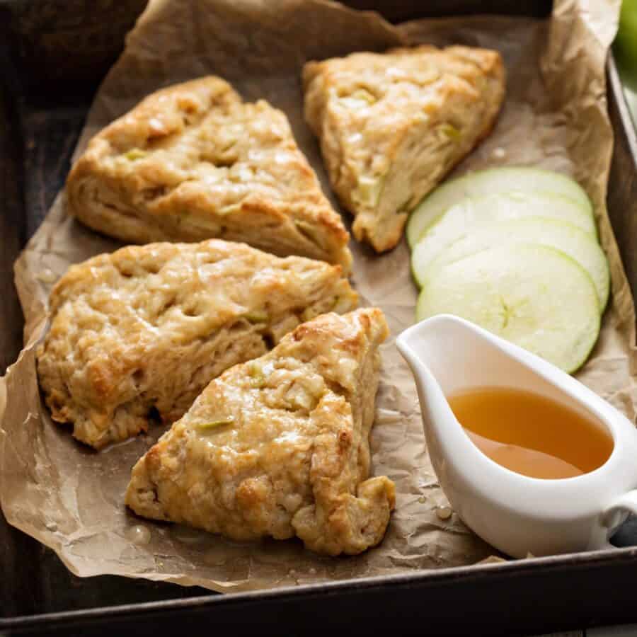 Apple Scones on parchment apper with caramel sauce