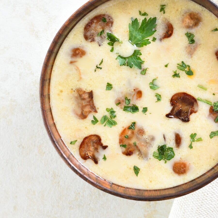 Close up image of Creamy Mushroom Soup in a brown bowl