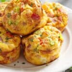 Close up image of Frittata Muffins on a white plate - 8