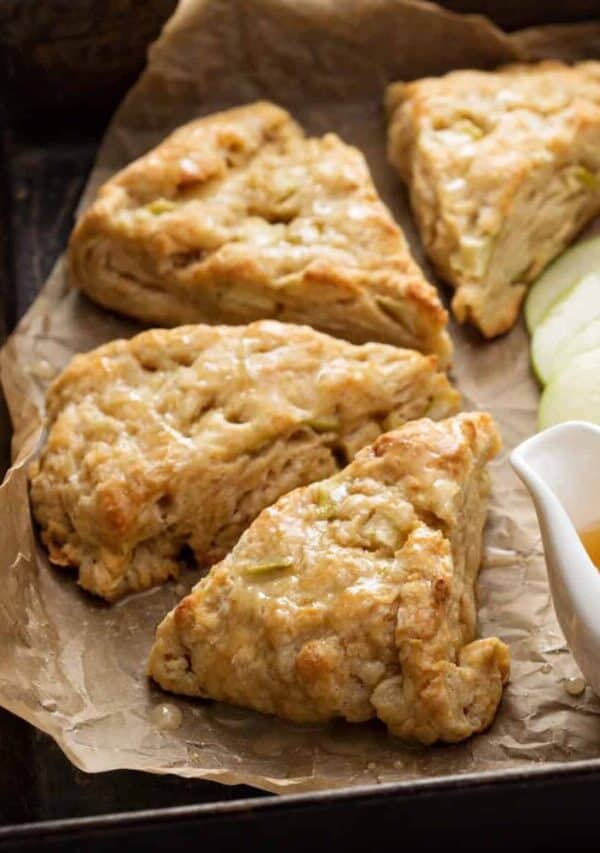 Apple Scones on parchment apper with caramel sauce