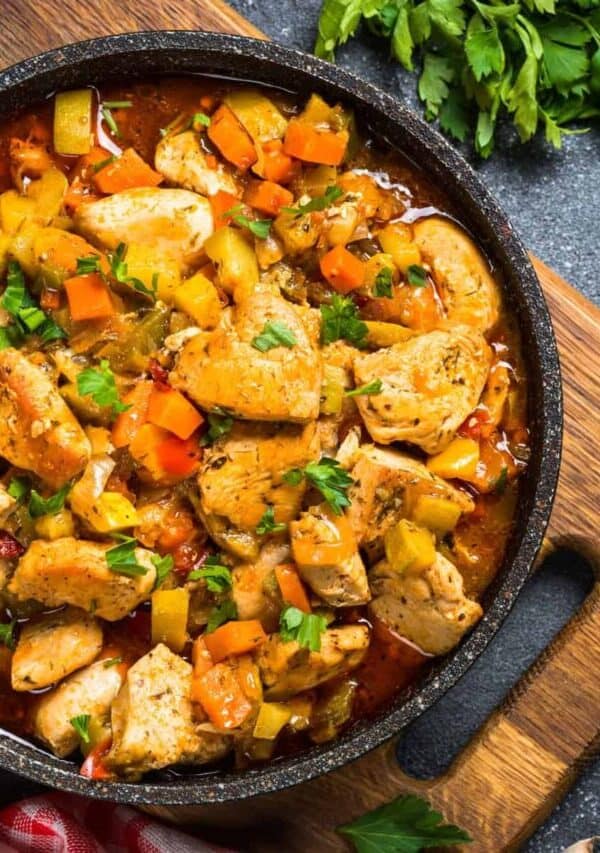 Overhead image of Slow Cooker Chicken Stew in a pan on top of a cutting board