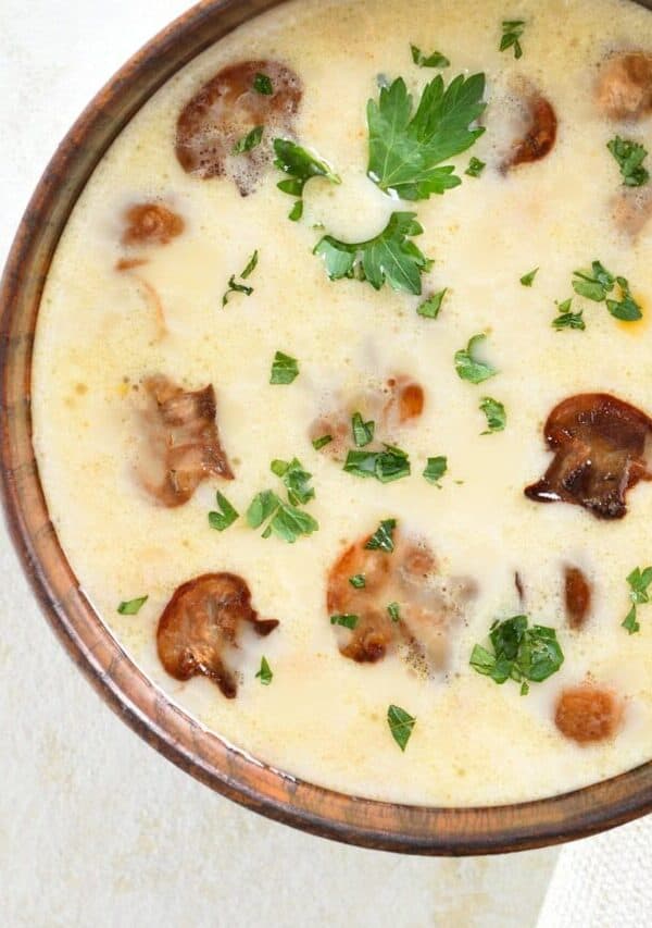 Close up image of Creamy Mushroom Soup in a brown bowl