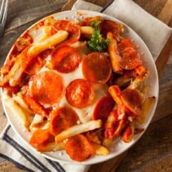 Canadian cuisine Overhead image of Air Fryer Pizza Fries on a white plate