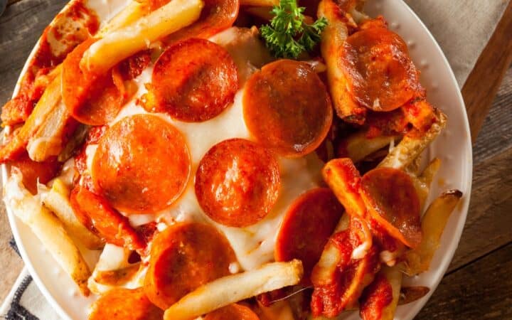 Overhead image of Air Fryer Pizza Fries on a white plate
