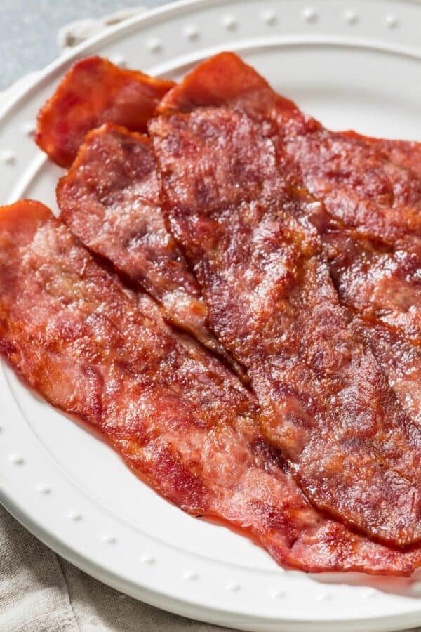 Overhead image of Air Fryer Turkey Bacon on a white plate