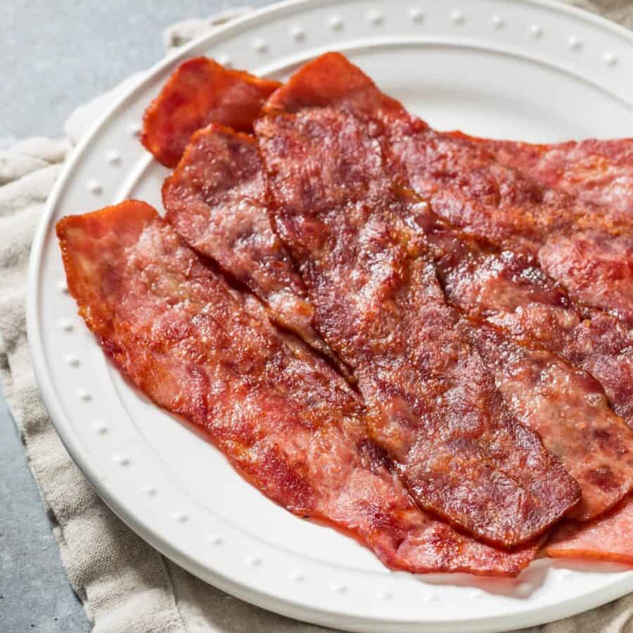 Overhead image of Air Fryer Turkey Bacon on a white plate