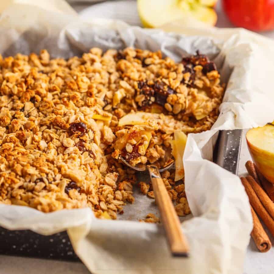 Baked Apple Cinnamon Oatmeal with a serving spoon