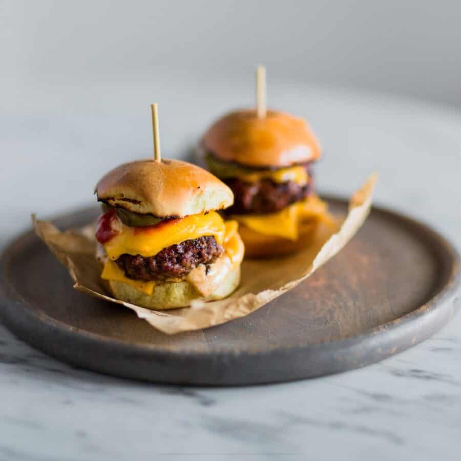 Two Cheeseburger Sliders on a gray plate