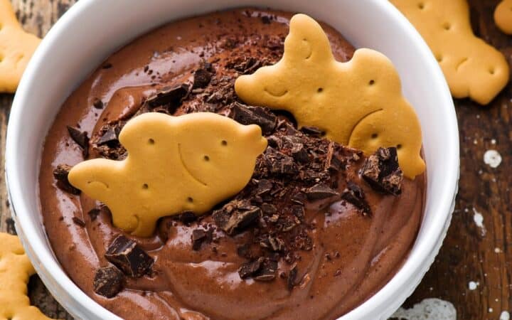 Overhead image of Edible Brownie Batter in a white bowl with cookies
