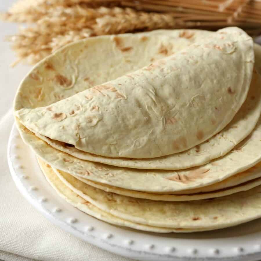 Close up image of Flour Tortillas on a white plate
