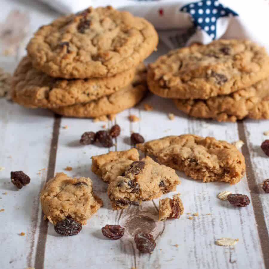 Oatmeal Cookies on a rustic surface with one broken into pieces