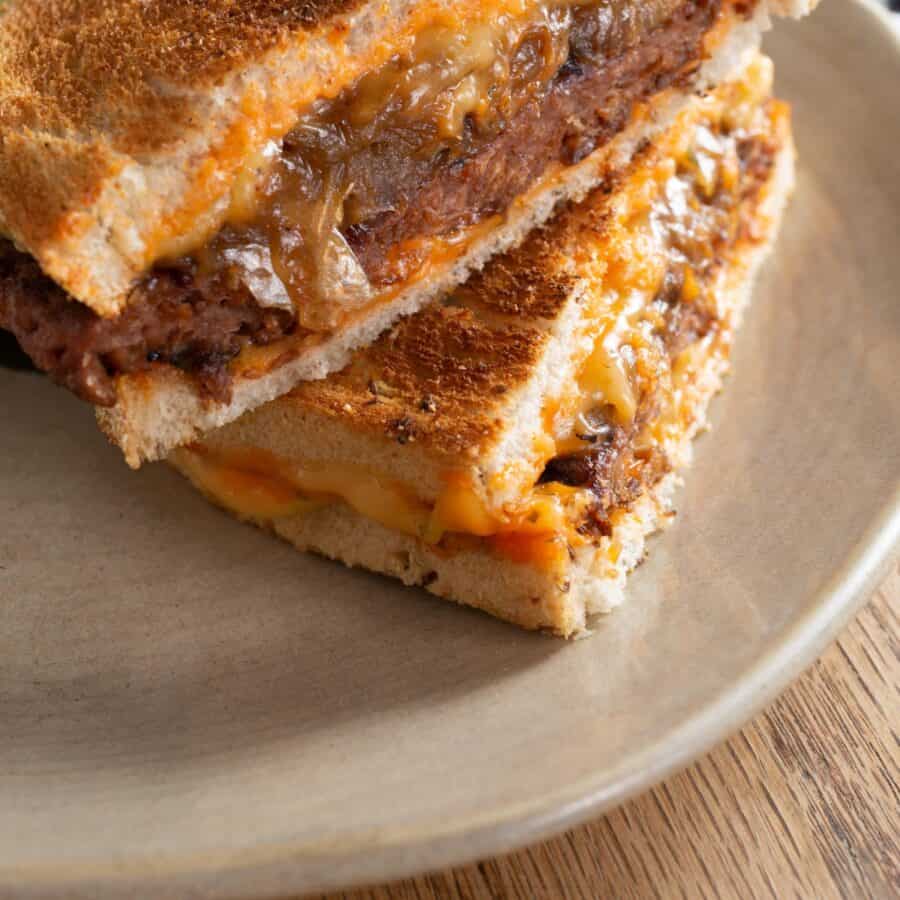 Close up image of a Patty Melt on a white plate 