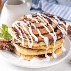 Ancient Greek cuisine A Stack of Cinnamon Roll Pancakes on a white plate