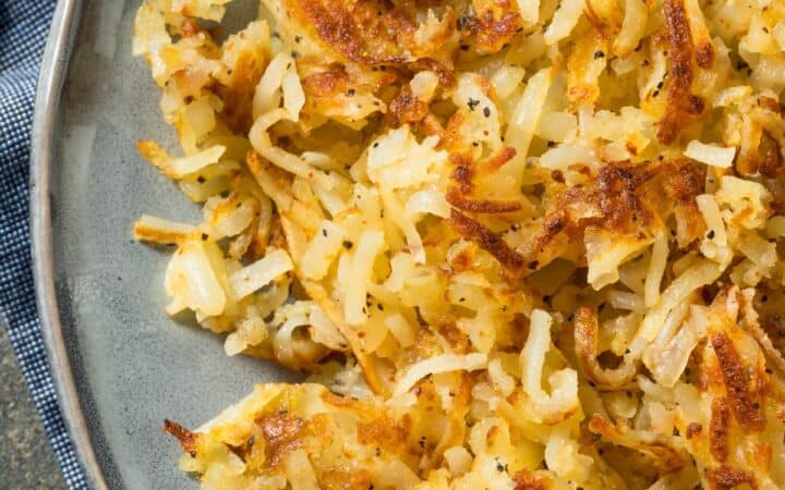 Overhead image of homemade hashbrowns on a gray plate
