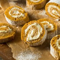 Close up image of Pumpkin Roll Slices on parchment paper