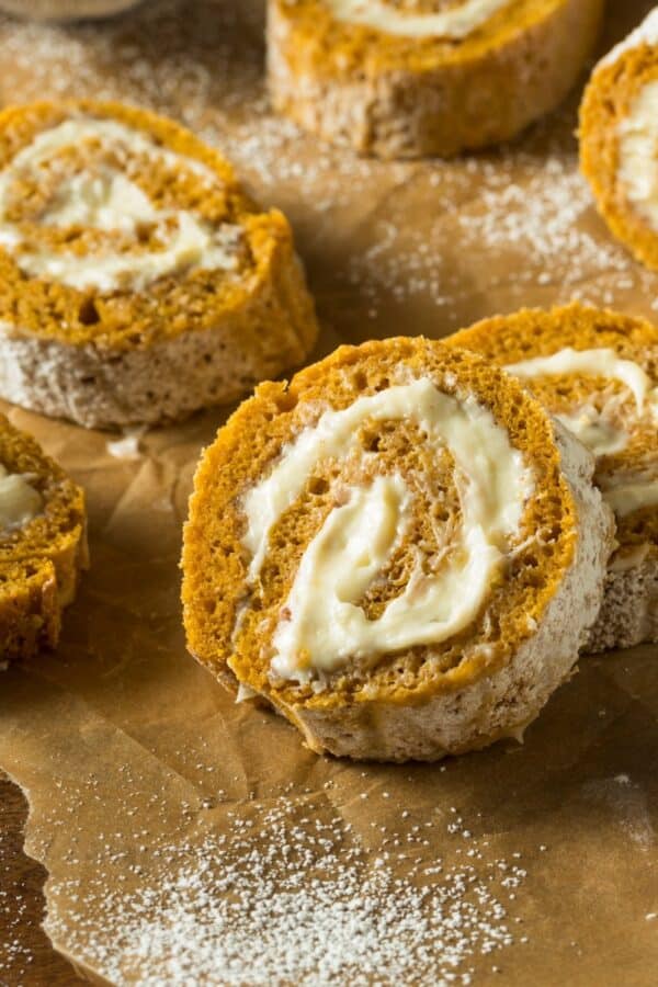 Close up image of Pumpkin Roll Slices on parchment paper