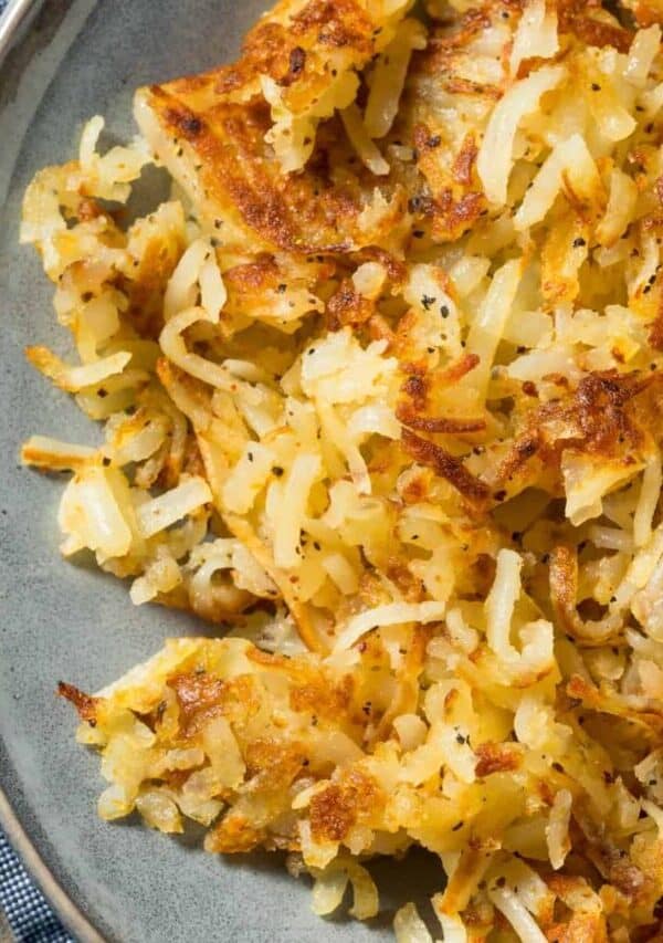 Overhead image of homemade hashbrowns on a gray plate