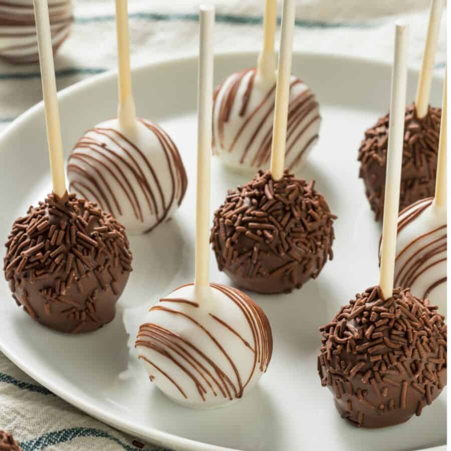 Close up image of cake pops on a white plate